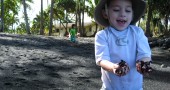 Playing at Richardson's Black Sand Beach