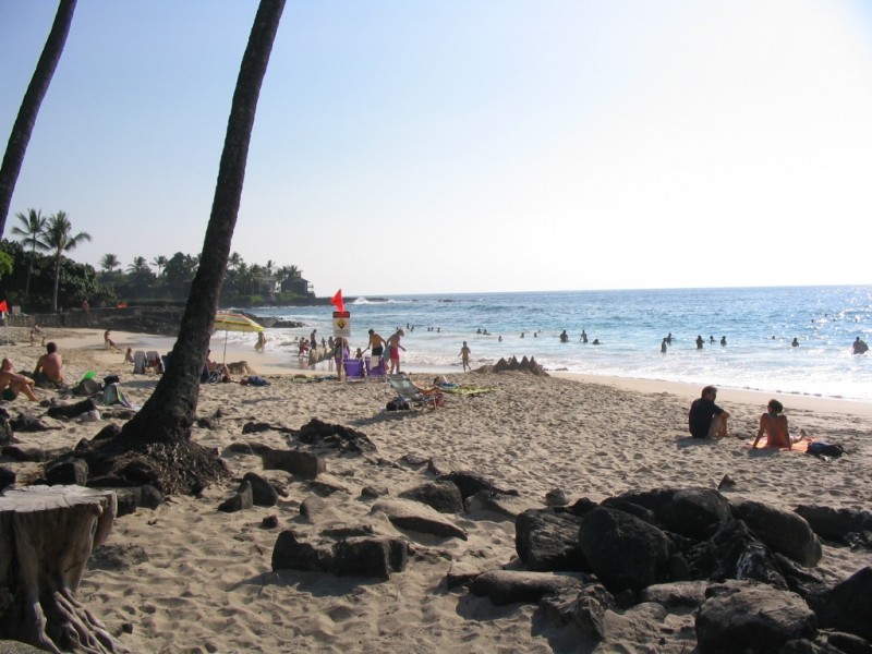 Sit on the sand and watch the body-boarders